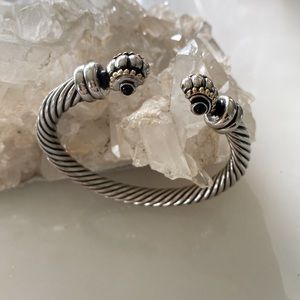 Two tone weighty bracelet with onyx like stones.